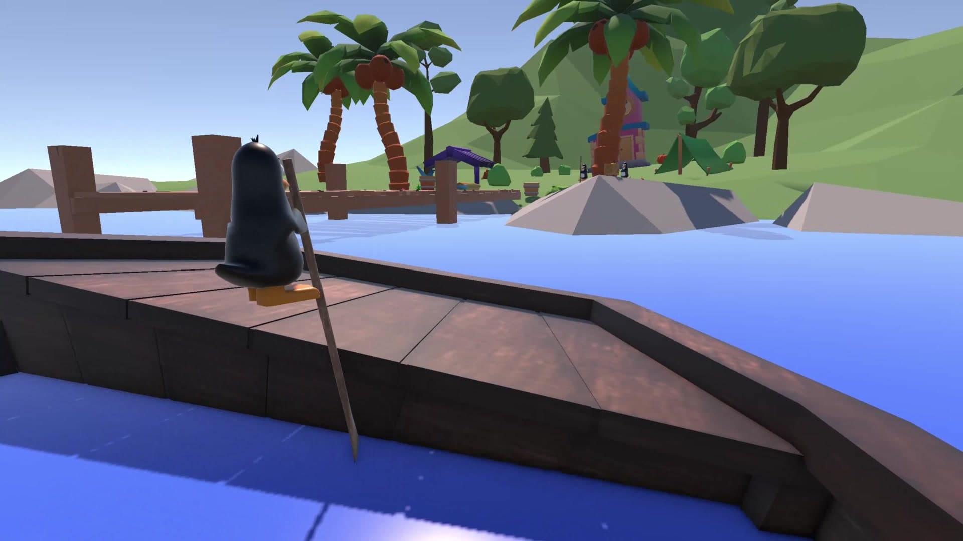 A penguin standing at the boat's edge looking at the island